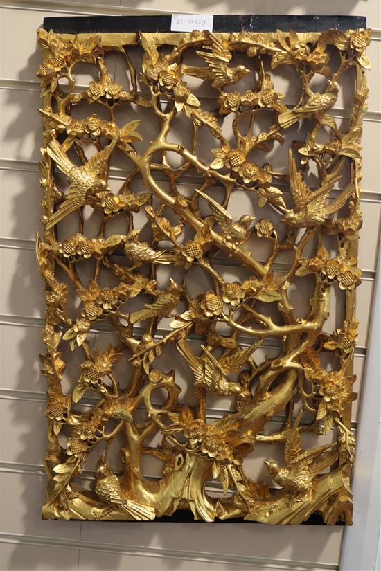 A set of six Chinese carved giltwood panels of birds amid prunus